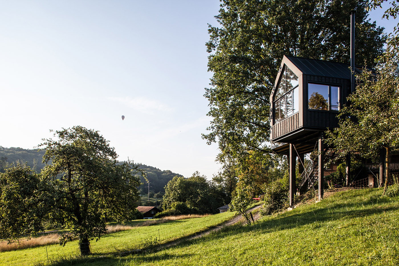 Tree house in Switzerland. A comfortable environment among the leaves of the trees