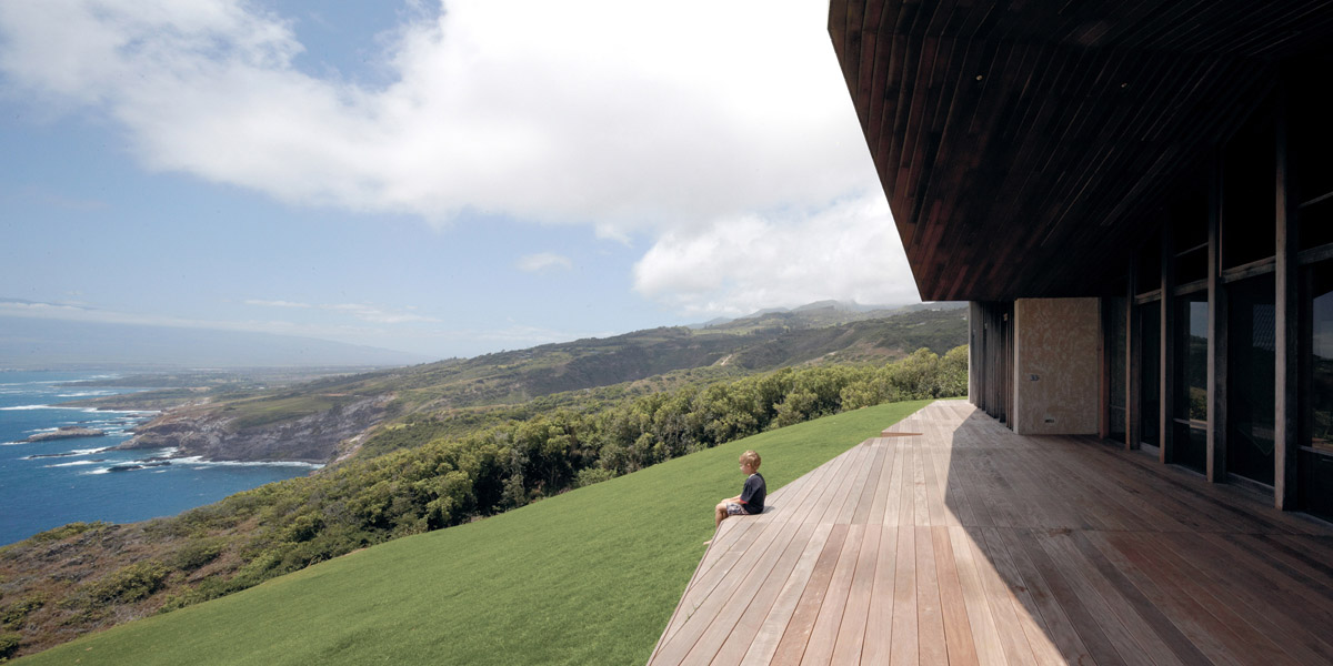 Home on a cliff in Hawaii. A common roof encloses several