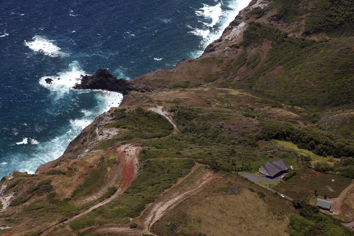 Home on a cliff in Hawaii. A common roof encloses several