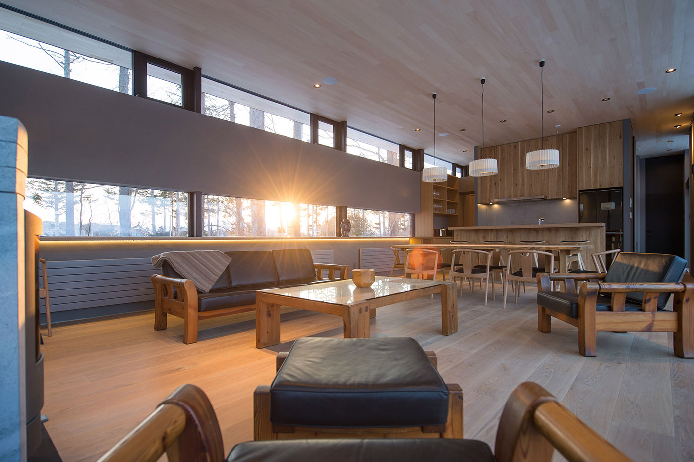 Architectural dialogue between cedar and metal for the Hiyoku home, a backdrop of Japan's snow-capped mountains
