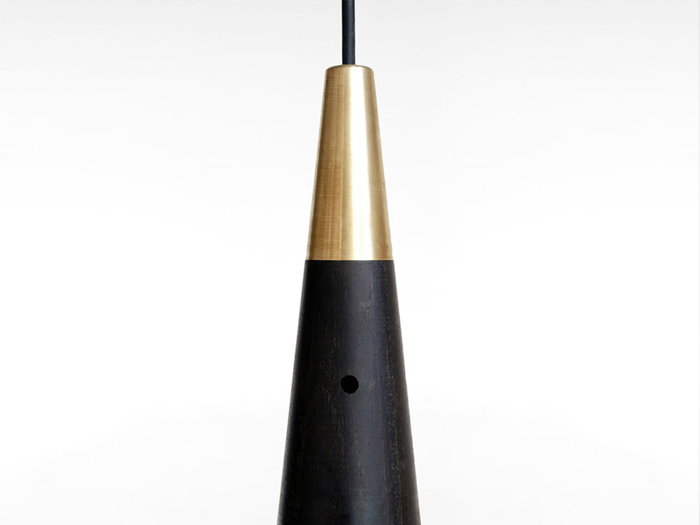 A balance between game and technology: a light in motion with the Trio wooden lamp