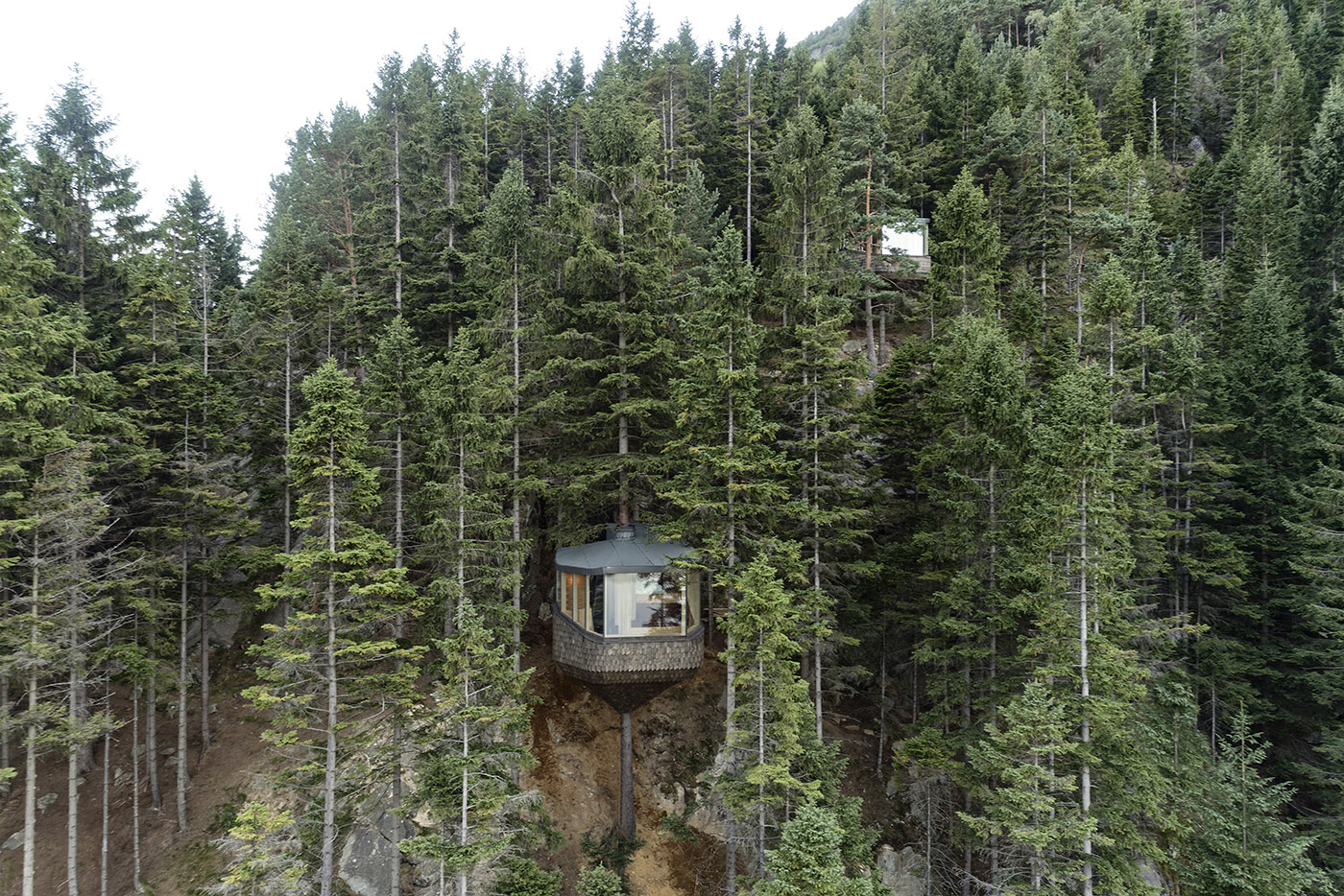 Two tree houses in Woodnest, on the steep woodland hills around Hardangerfjord