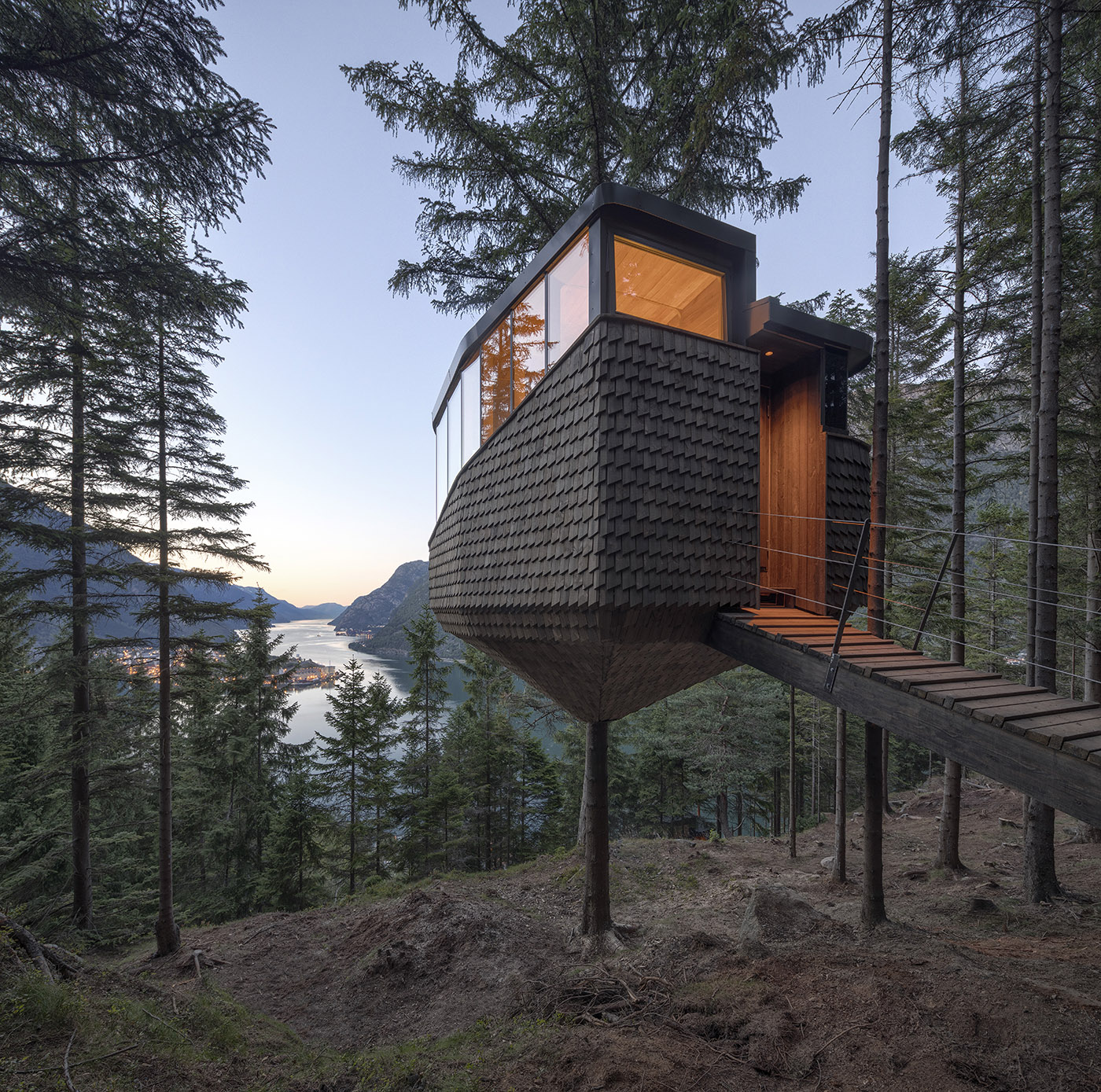 Two tree houses in Woodnest, on the steep woodland hills around Hardangerfjord