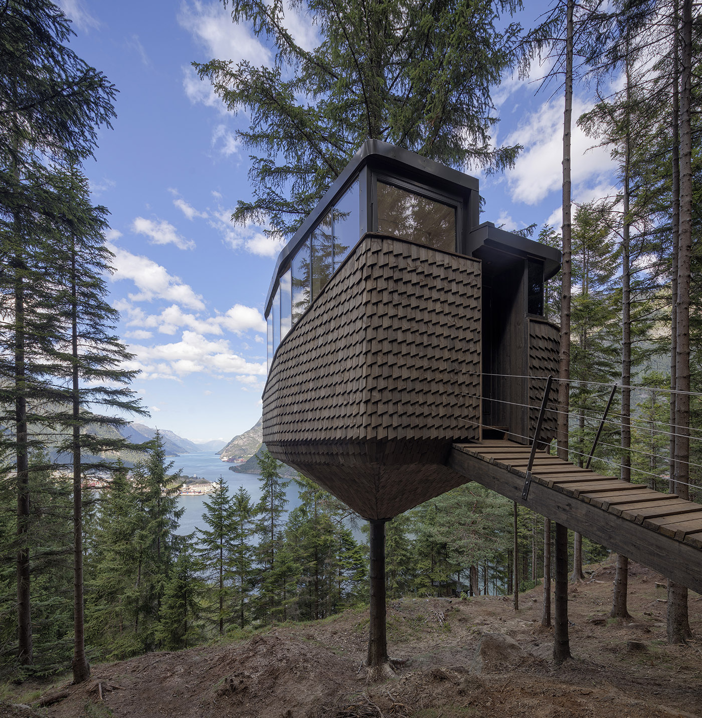 Two tree houses in Woodnest, on the steep woodland hills around Hardangerfjord