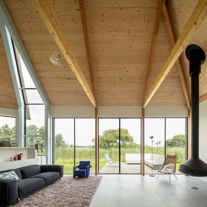 Dutch Dike House. A stunning glass fissure transforms the traditional structure