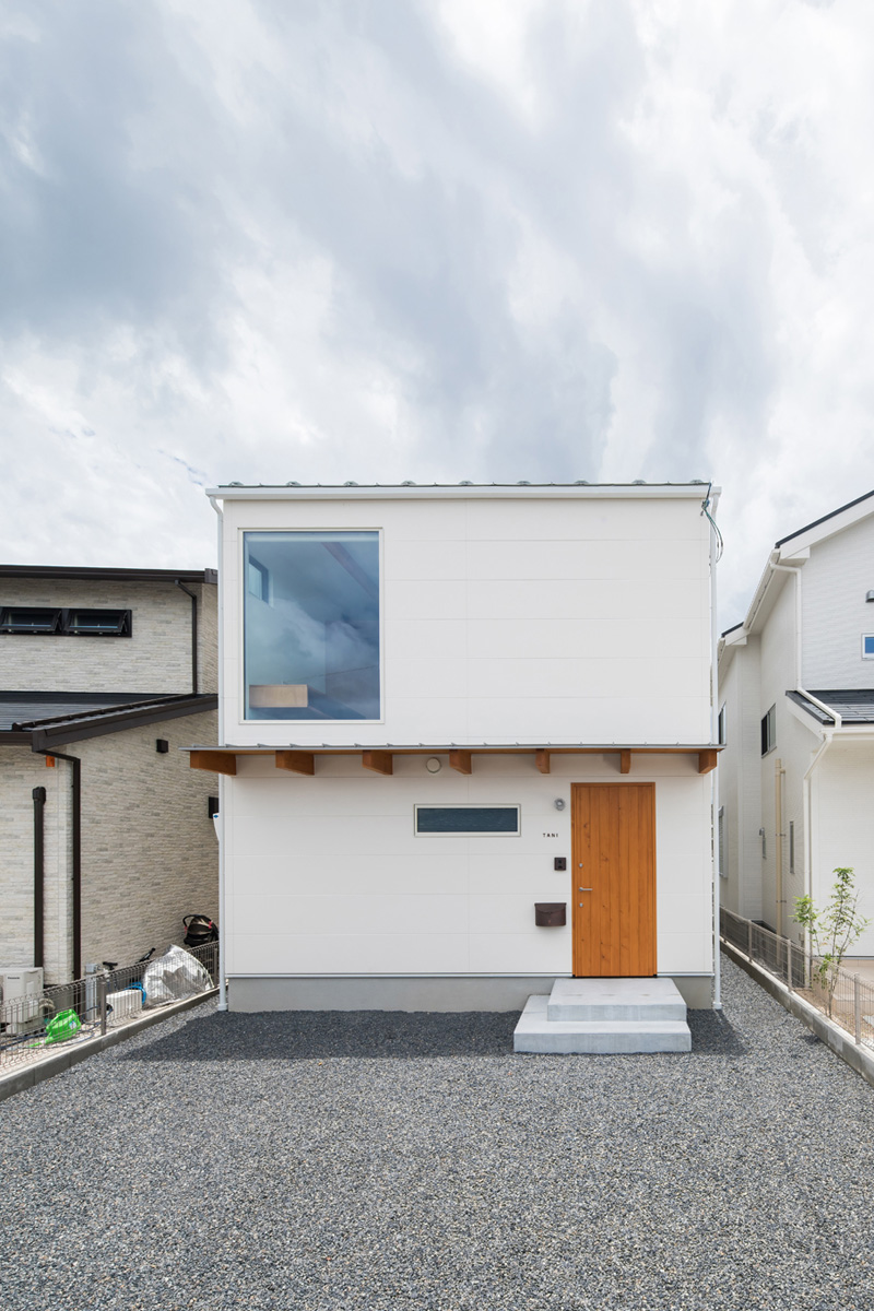 White wall with wooden entrance door