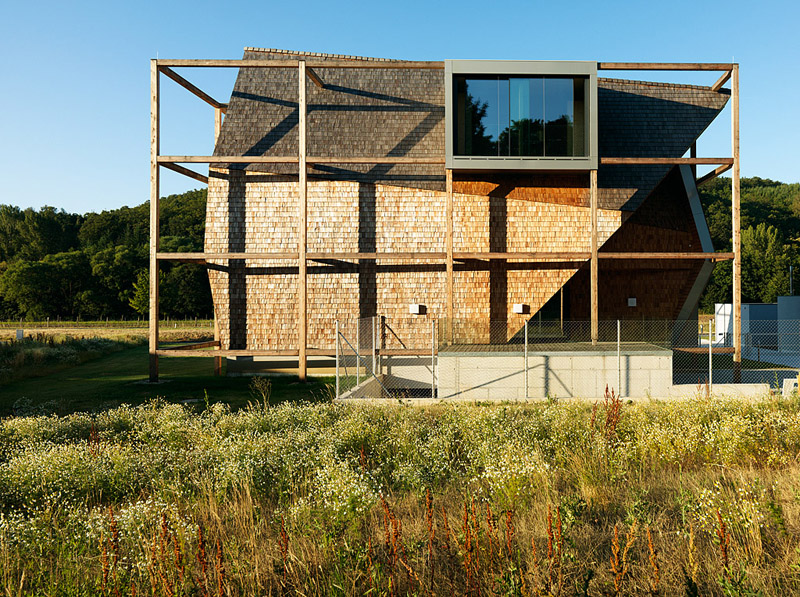 Larch office building exterior, with Canadian pine roof and prefabricated panels
