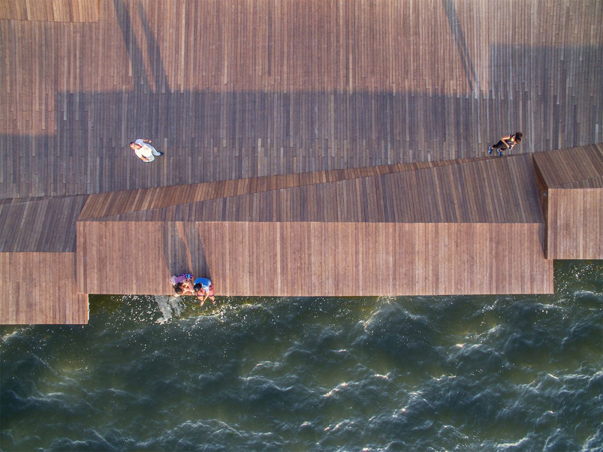 Cantilevered wooden bridge over the sea