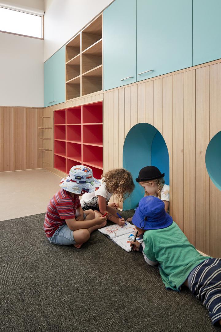 Interior of a school with colored wooden furniture