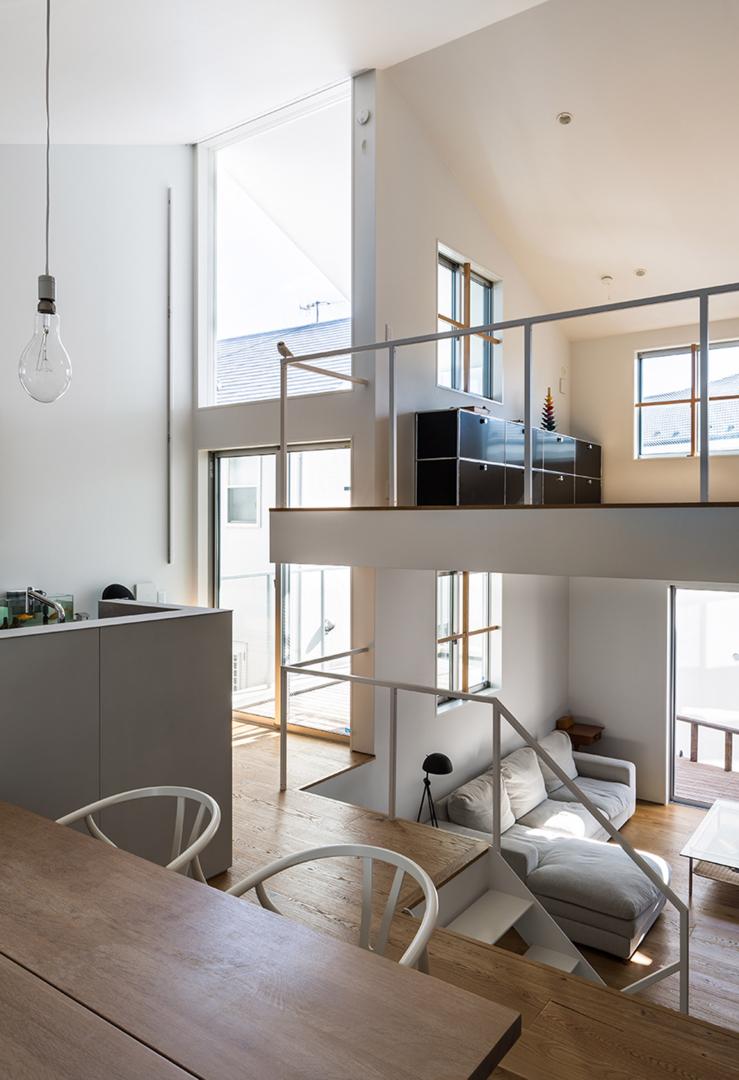 Cantilevered wooden house with horizontal slats