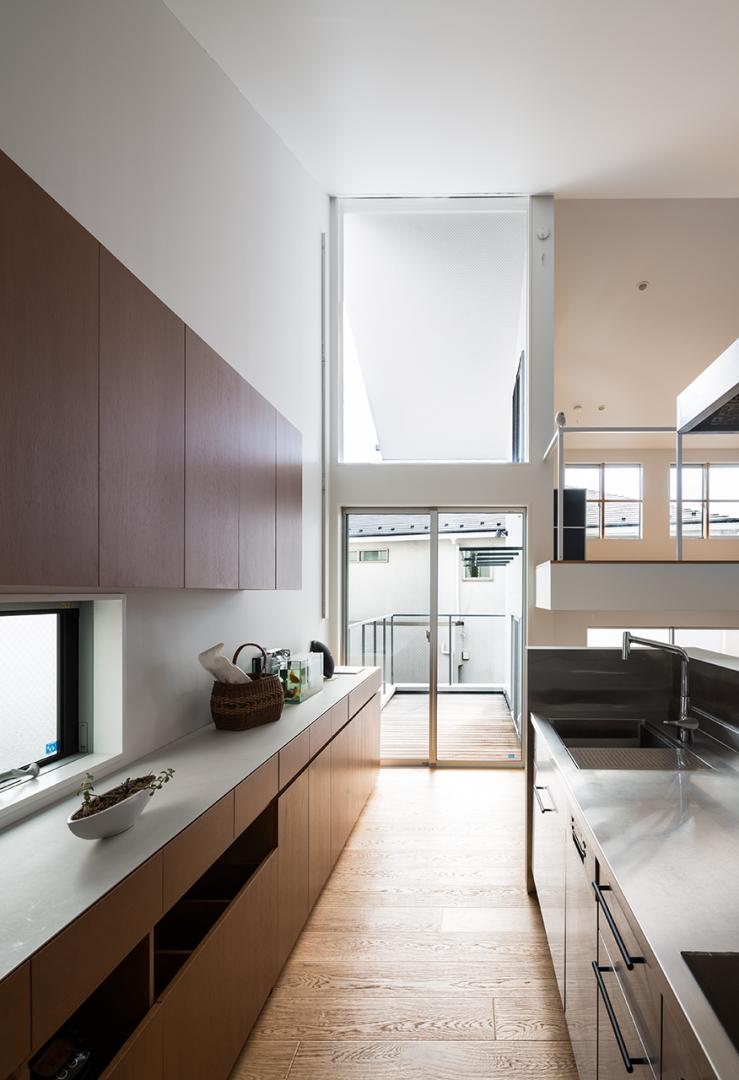 Cantilevered wooden house with horizontal slats