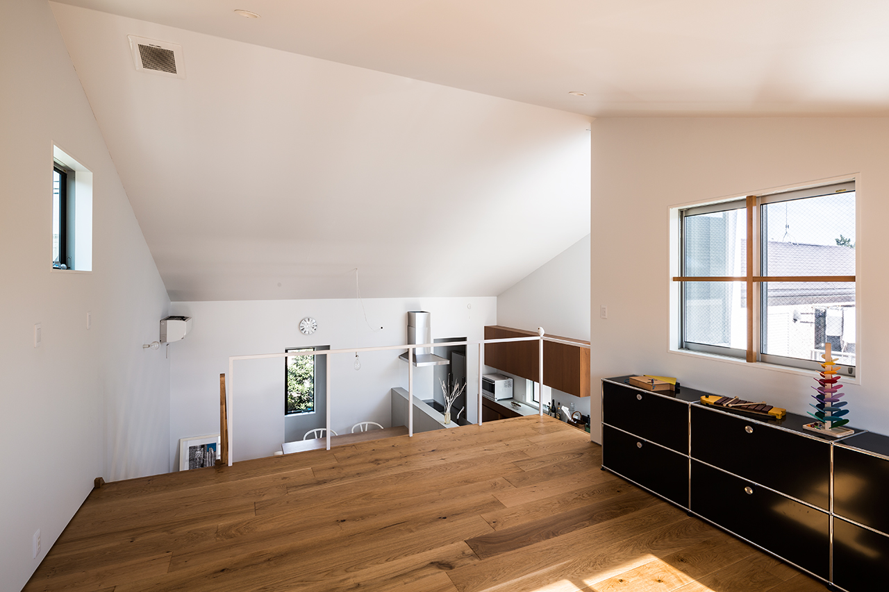 Cantilevered wooden house with horizontal slats