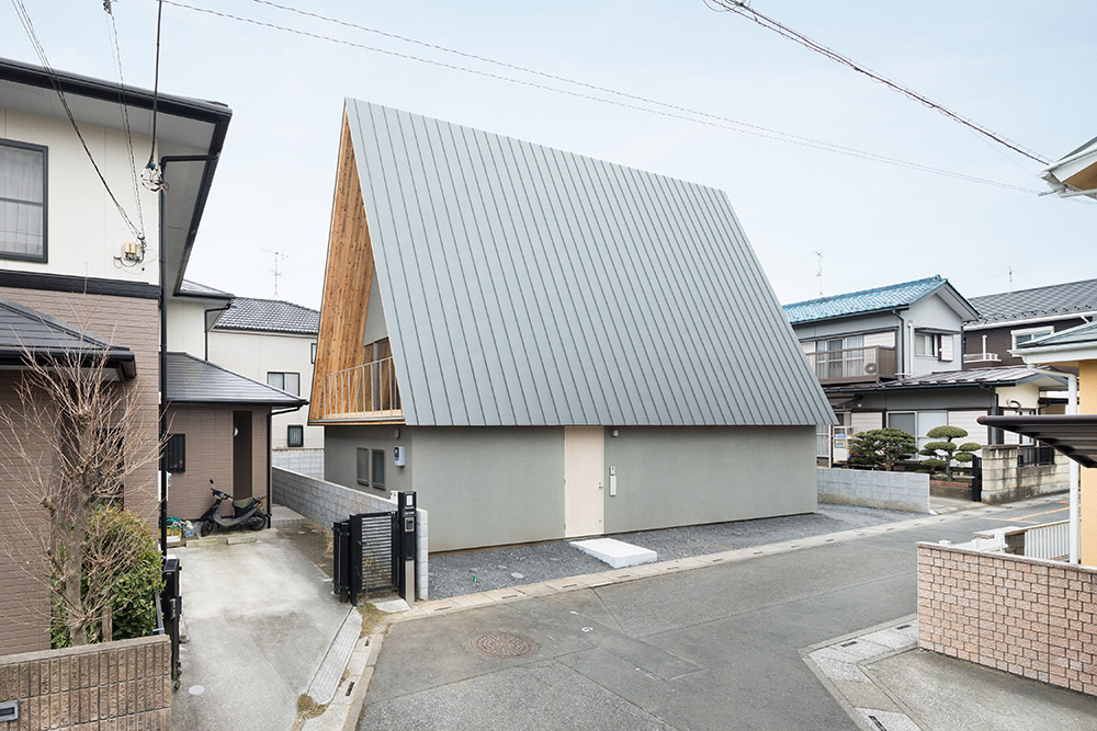 House shaped like a triangular prism