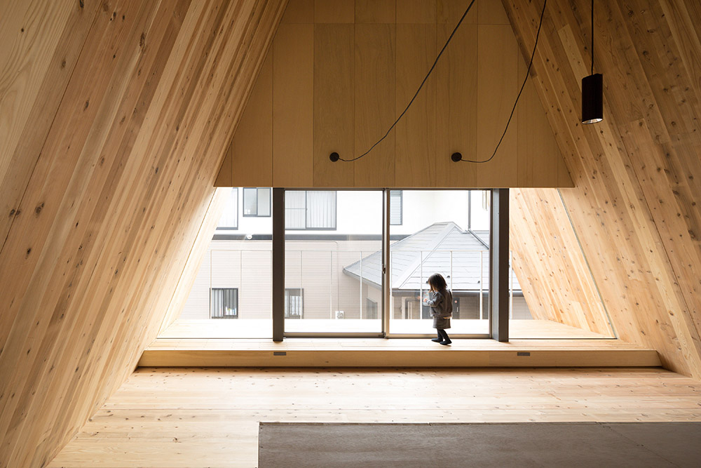 House shaped like a triangular prism