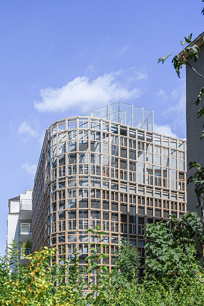 Building with wooden net around