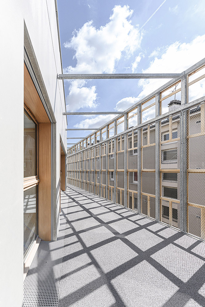 Building with wooden net around