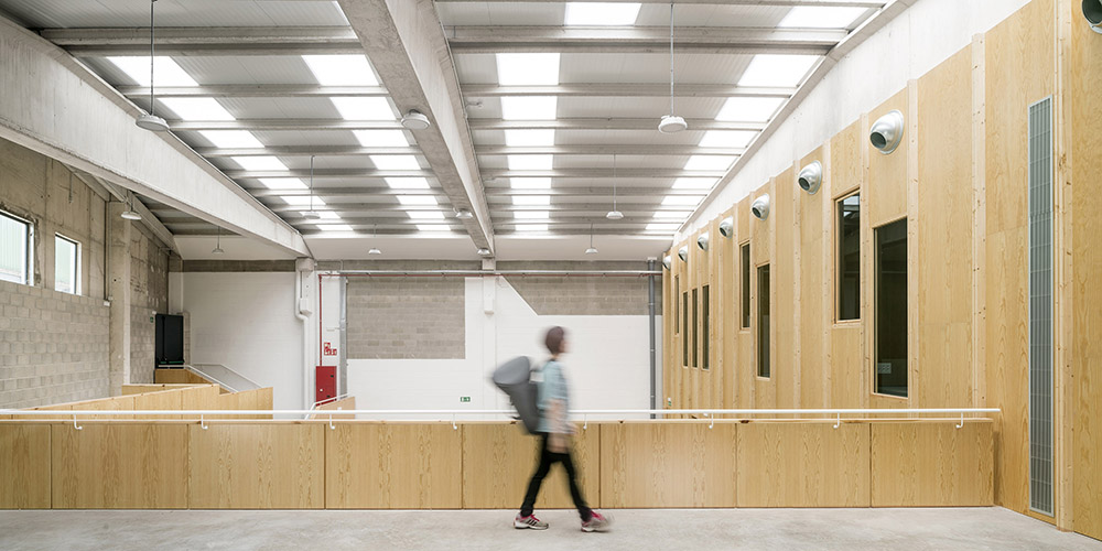 Multifunctional center with wood-clad interior