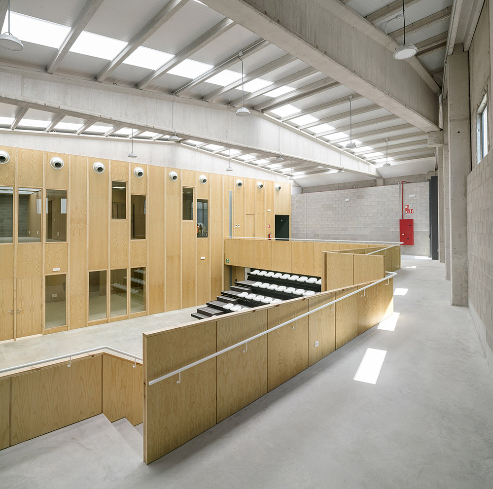 Multifunctional center with wood-clad interior