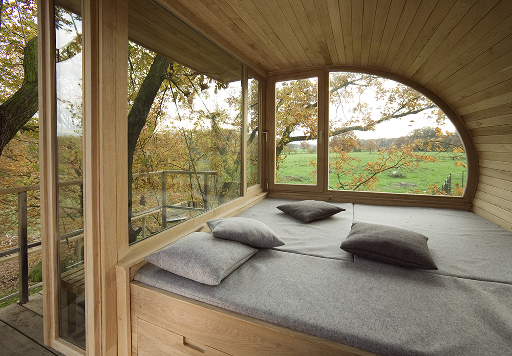 Semicircular house among the trees