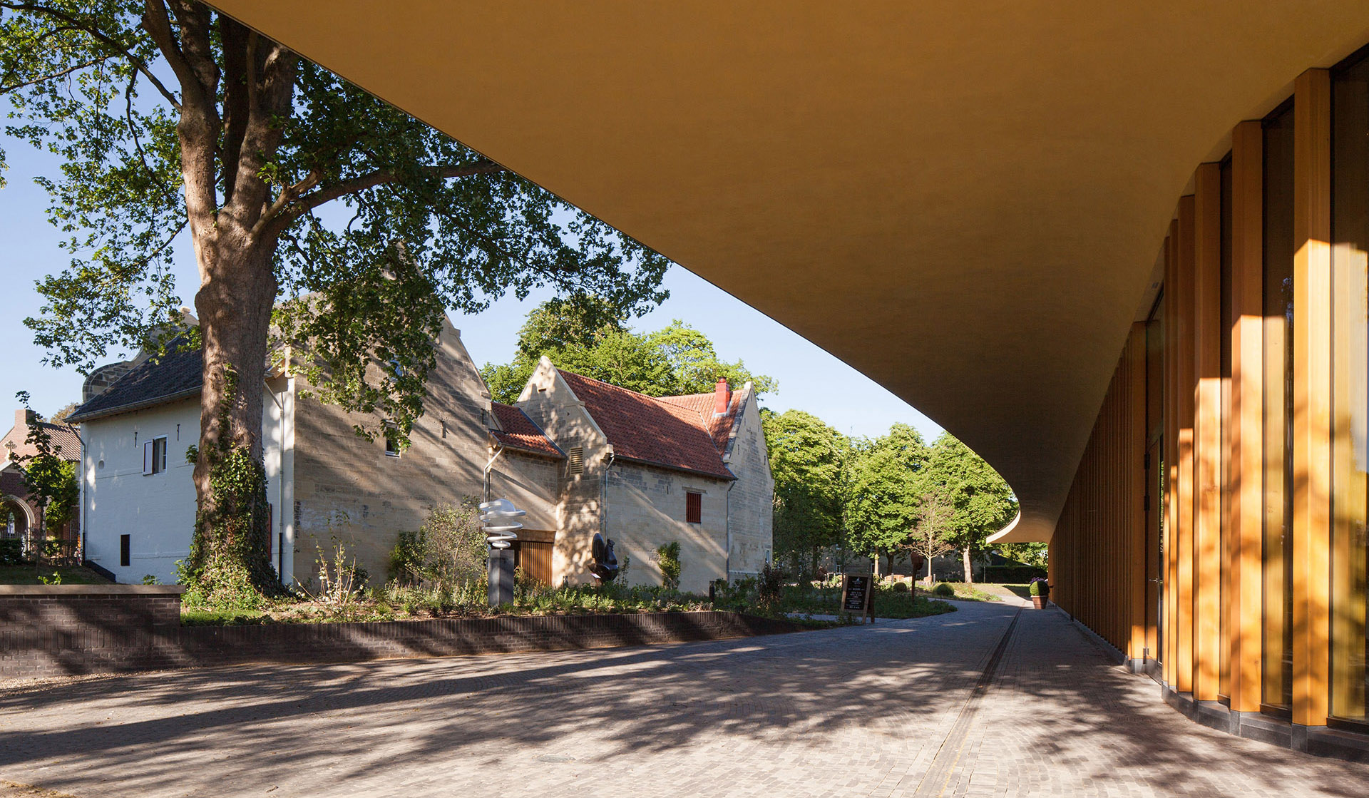 Estate on the outskirts of Maastricht. Contemporary pavilion surrounded by historic buildings on the site