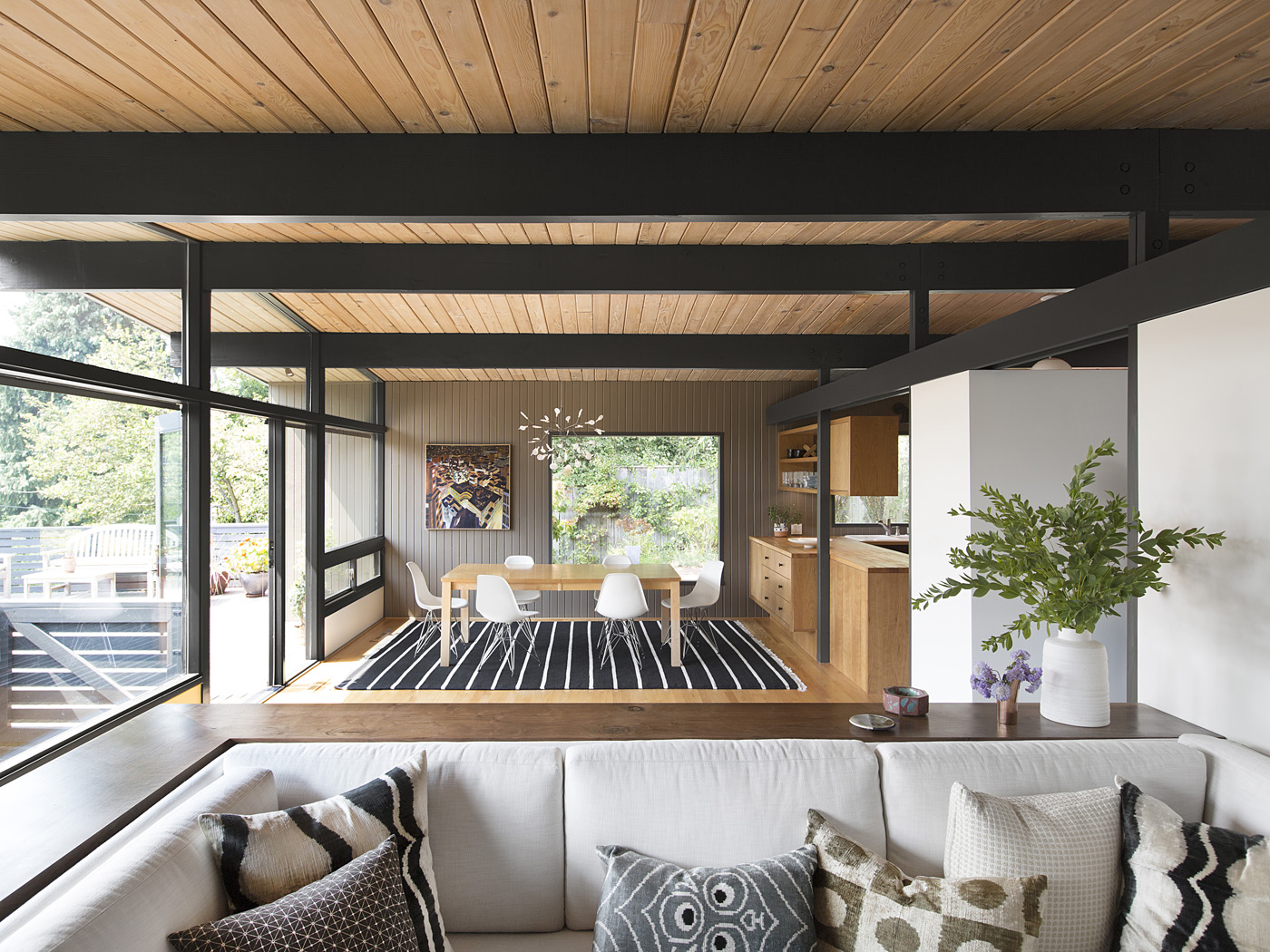 The metal structure and the wood covering above the kitchen