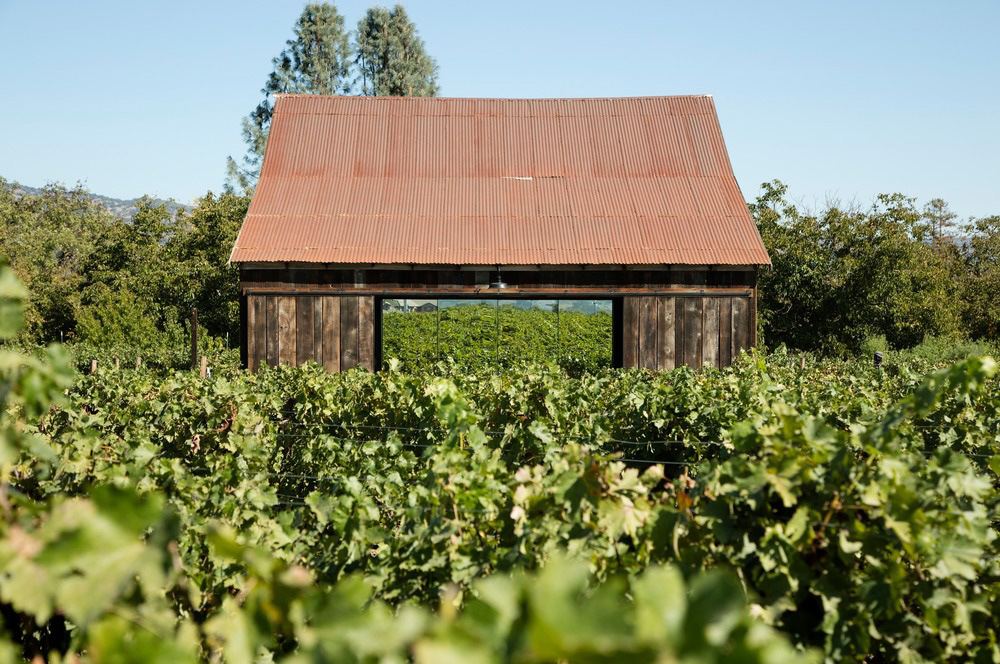 The exterior of the restored wooden barn
