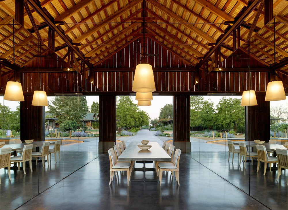 The wooden roof wraps around the large room