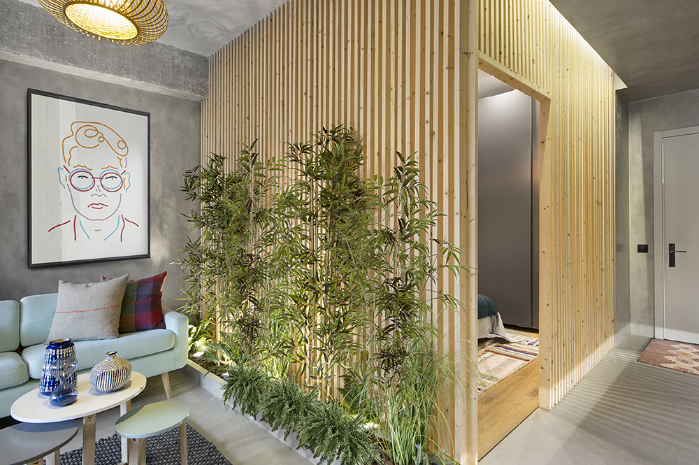 A wooden cube wraps around the bedroom