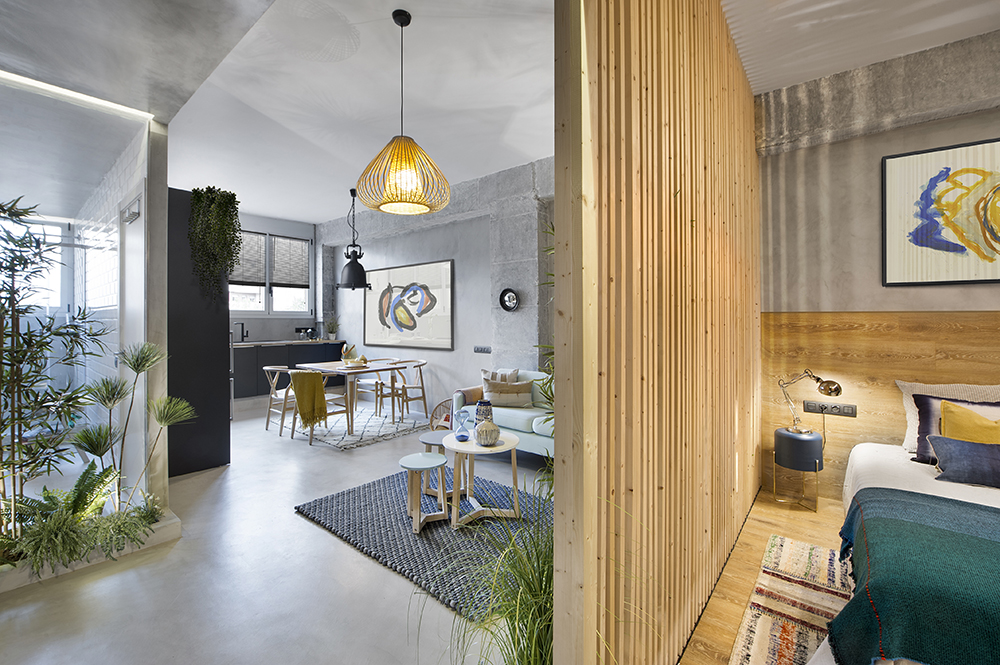 A wooden cube wraps around the bedroom