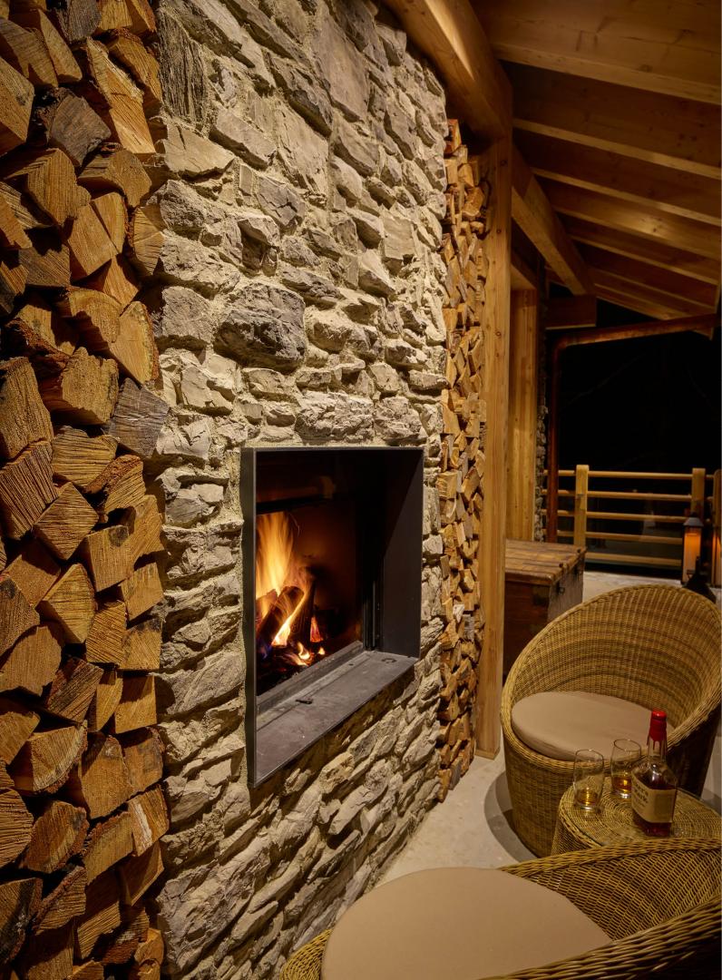 Resort with antique wooden structure and stone cladding