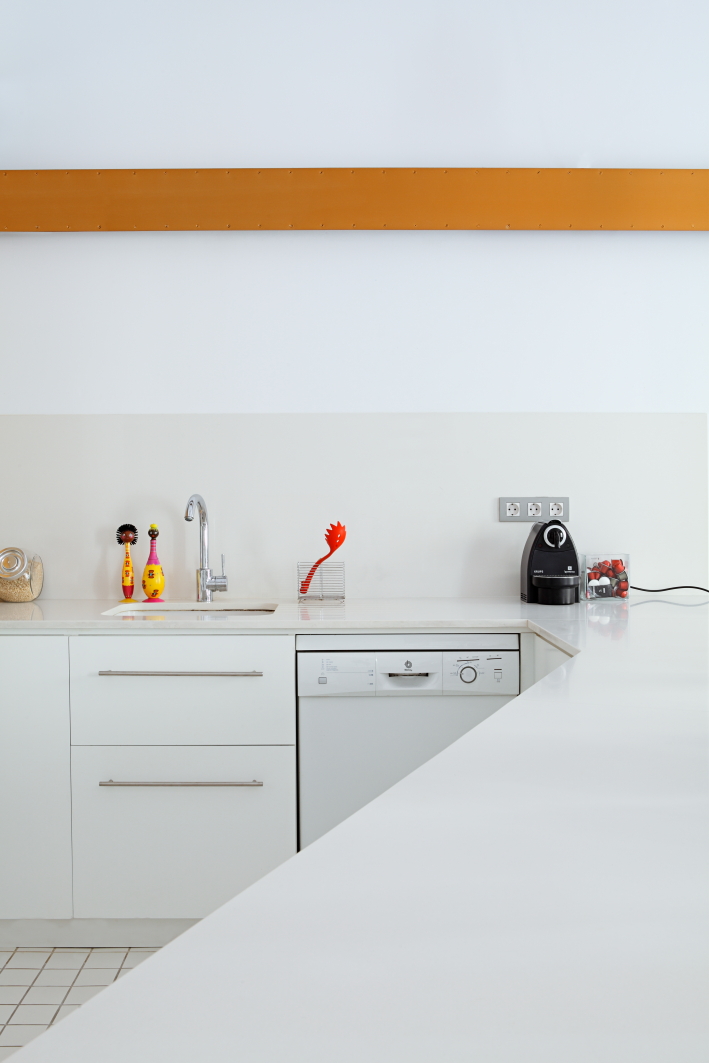 Kitchen and living spaces white and black sofa