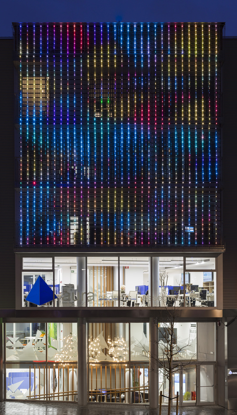 Night facade perforated metal colored lights