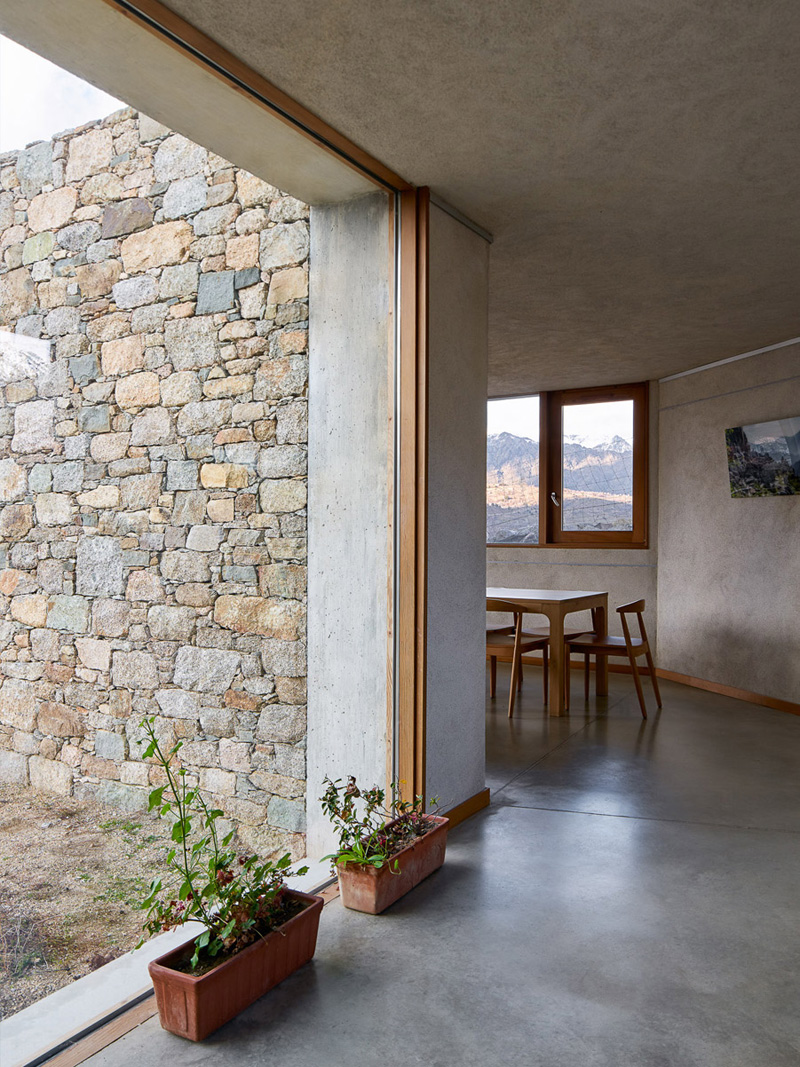 large glass window and stone wall