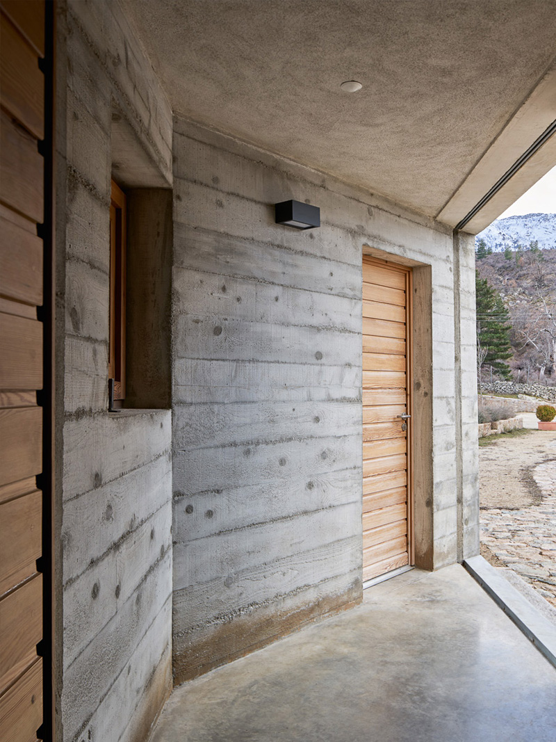 large glass window and stone wall