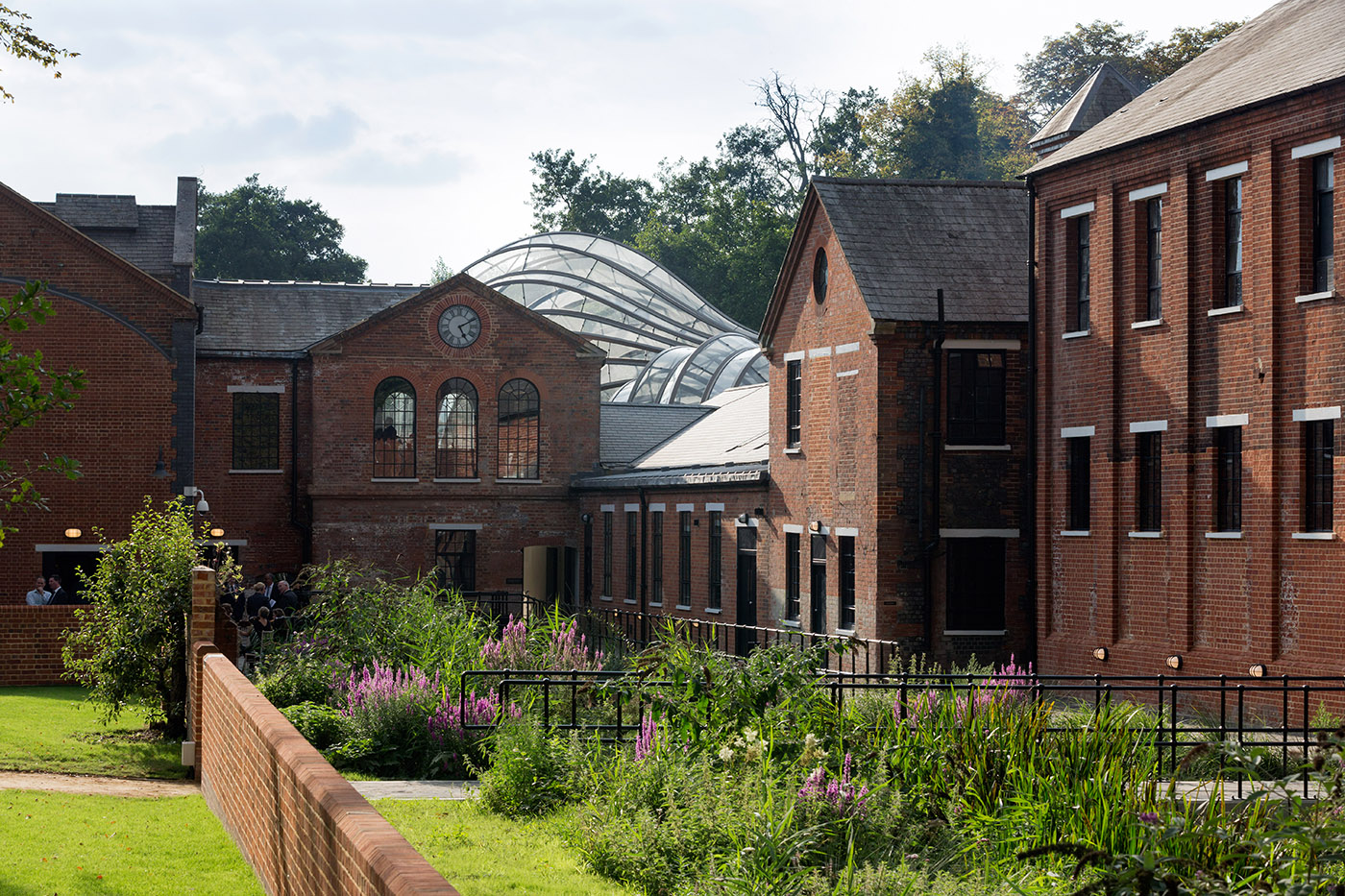 Glass greenhouse between historic buildings