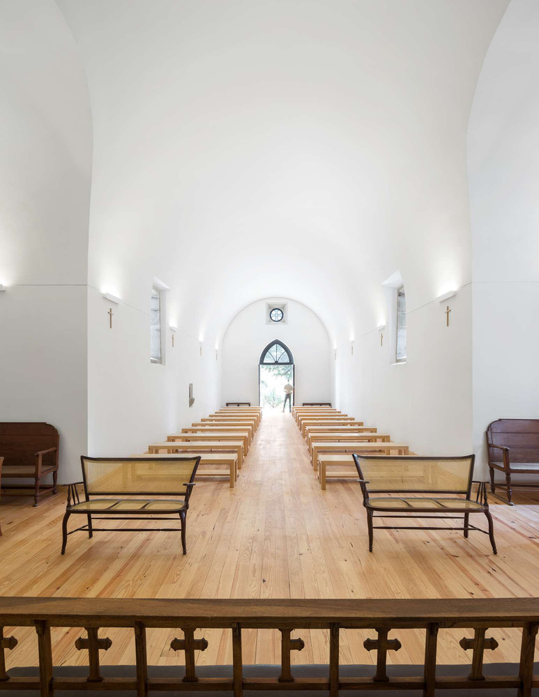 White chapel interior with parquet