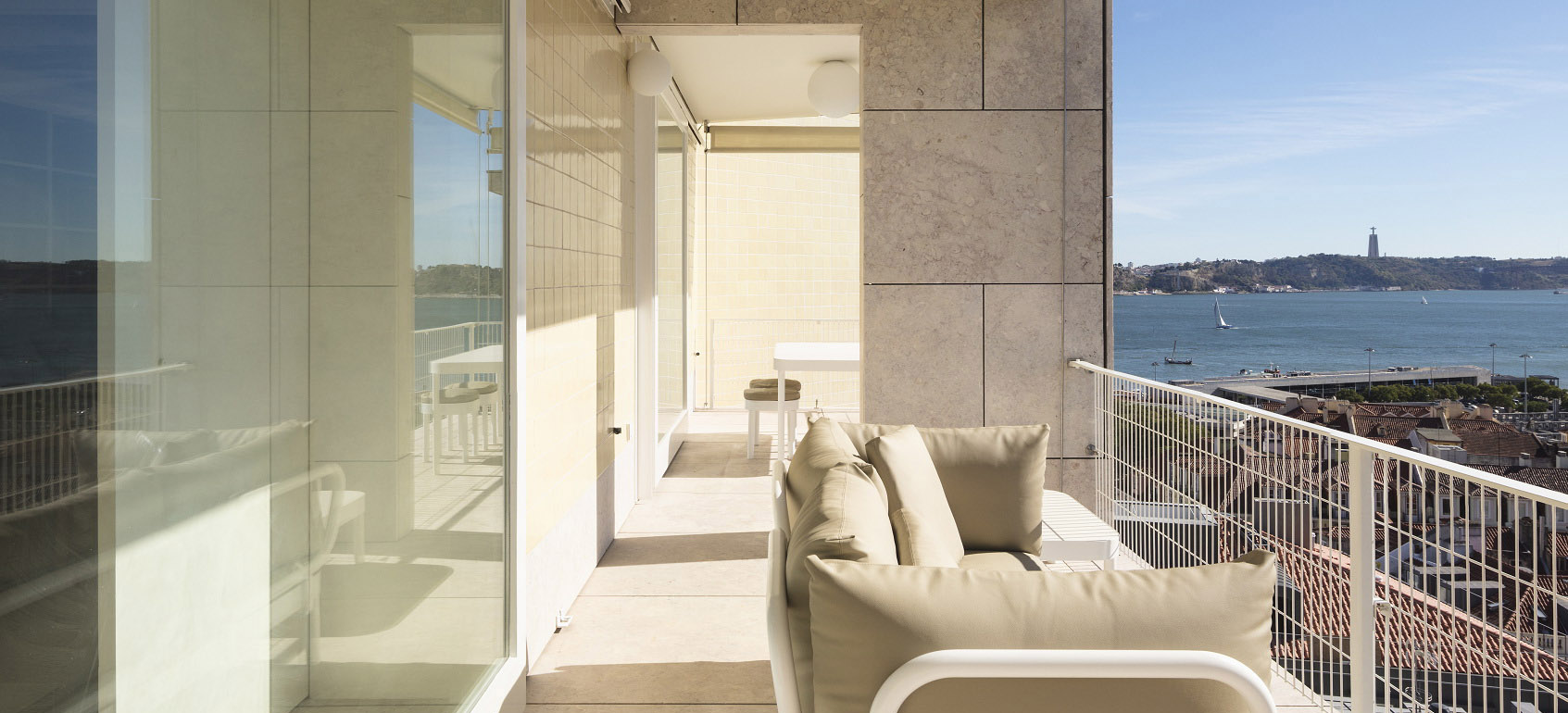 A modern apartment interior with a view over Lisbon, representing a property subject to capital gains tax.