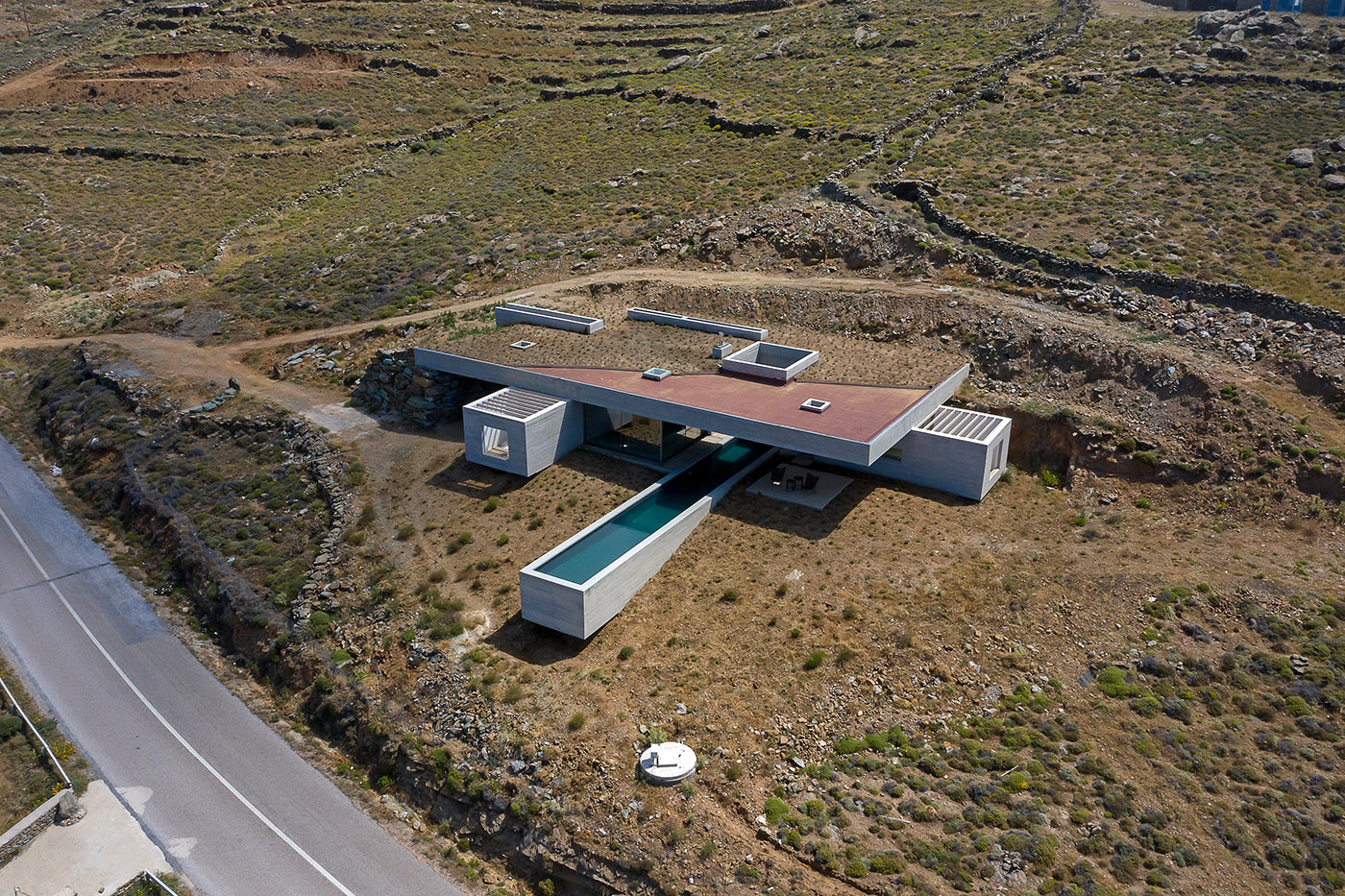 Lap Pool House: an artificial cave carved into the natural landscape of a Greek island