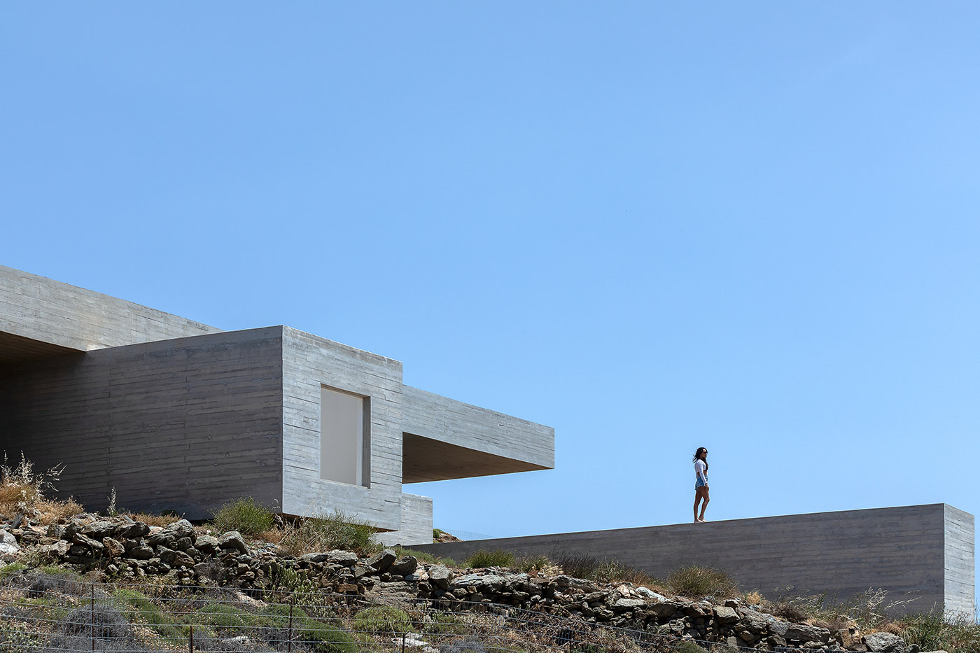 Lap Pool House: an artificial cave carved into the natural landscape of a Greek island