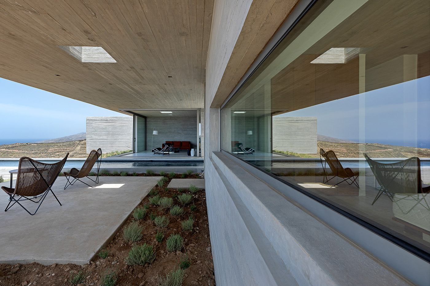 Lap Pool House: an artificial cave carved into the natural landscape of a Greek island