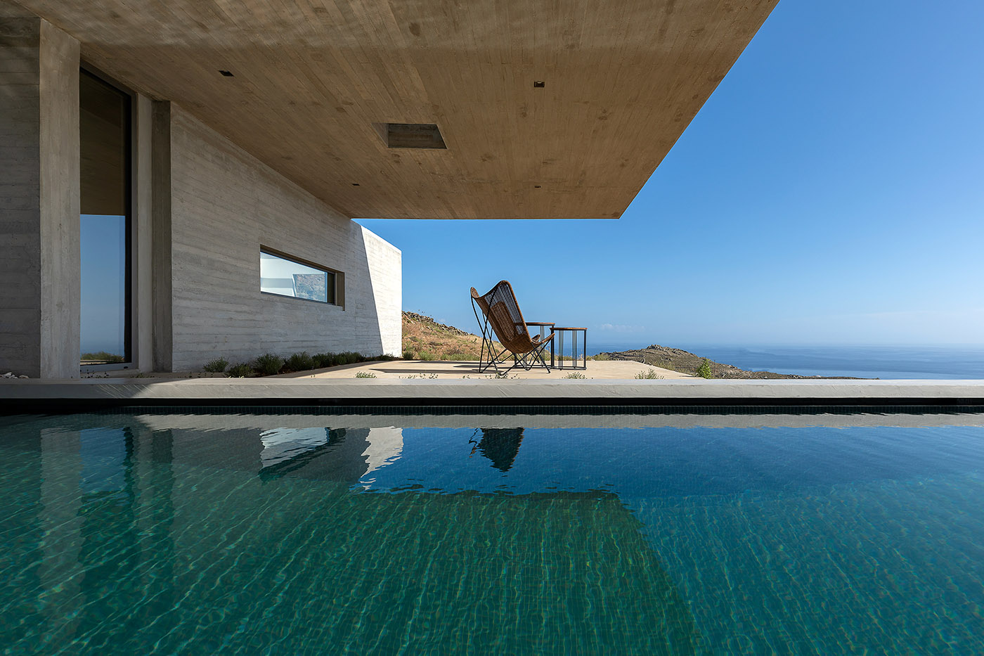 Lap Pool House: an artificial cave carved into the natural landscape of a Greek island