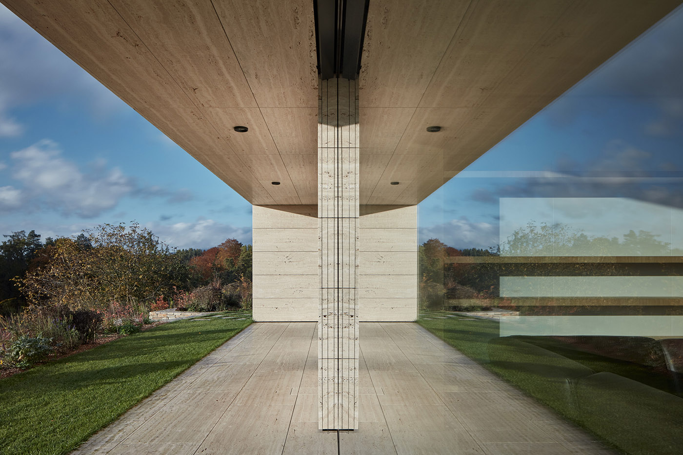 The stone wraps around a villa built on a slope in the Bohemian Paradise