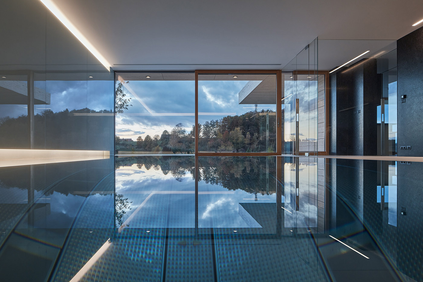 The stone wraps around a villa built on a slope in the Bohemian Paradise