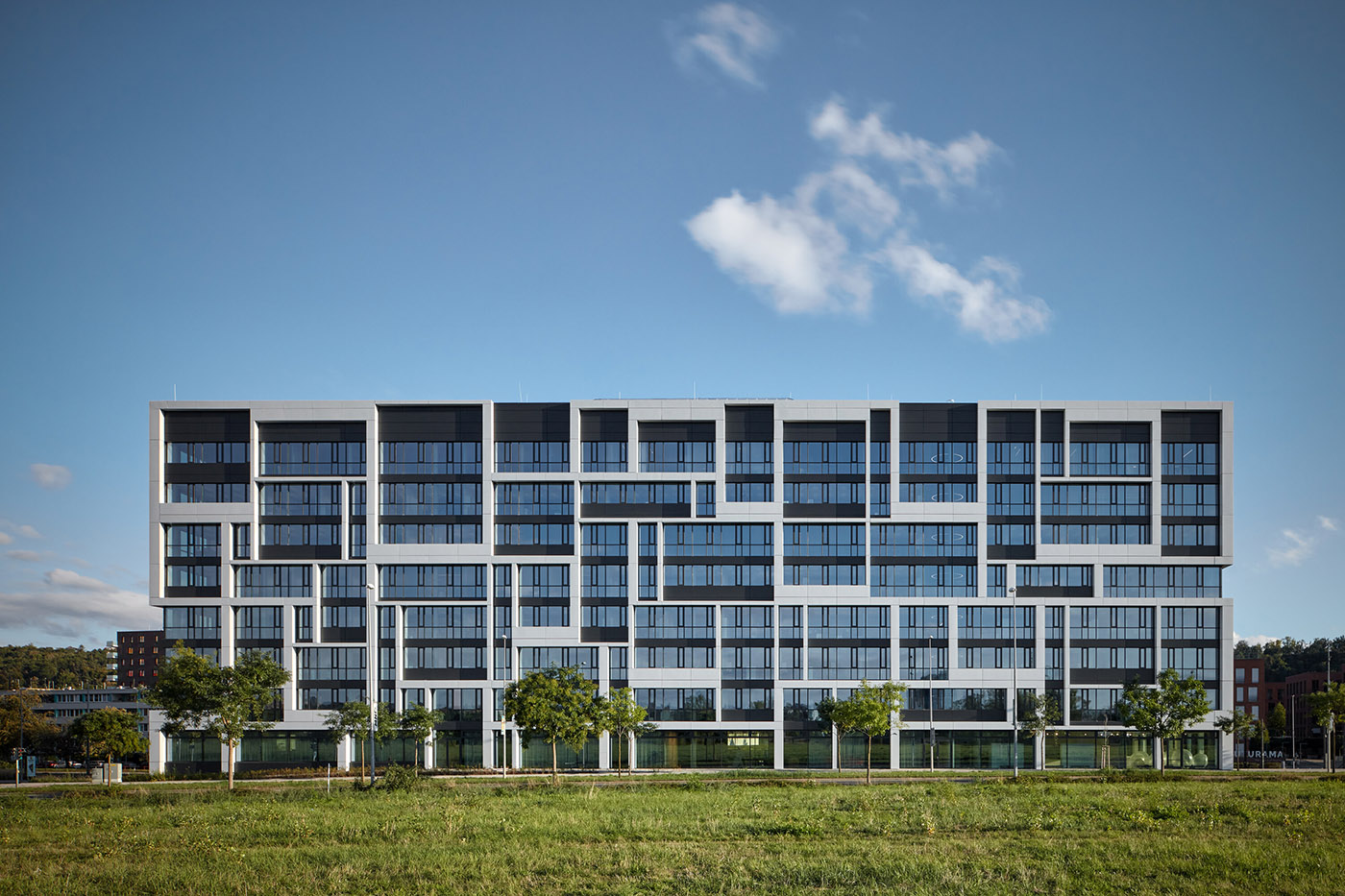 The facade of the new J&T corporate headquarters reflects the abstract ...