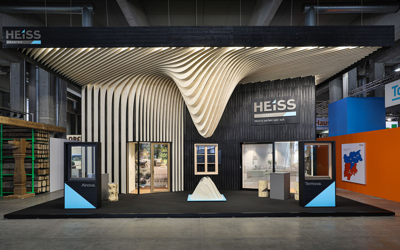 Exhibit design project Suspended Folds. A trade show booth conceived reflecting on the malleability of wood