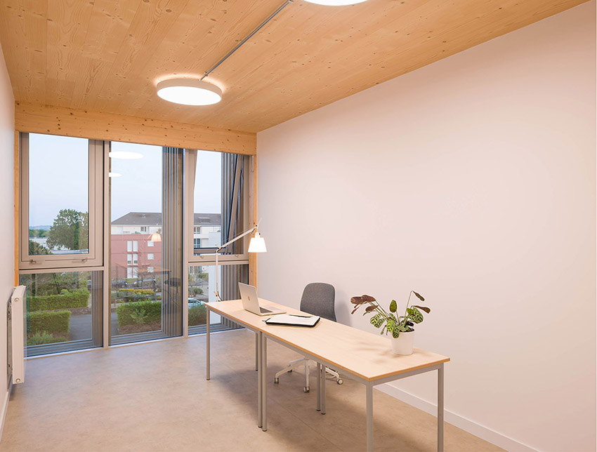 The ASSIA headquarters extension. Building structure in wood, concrete and glass