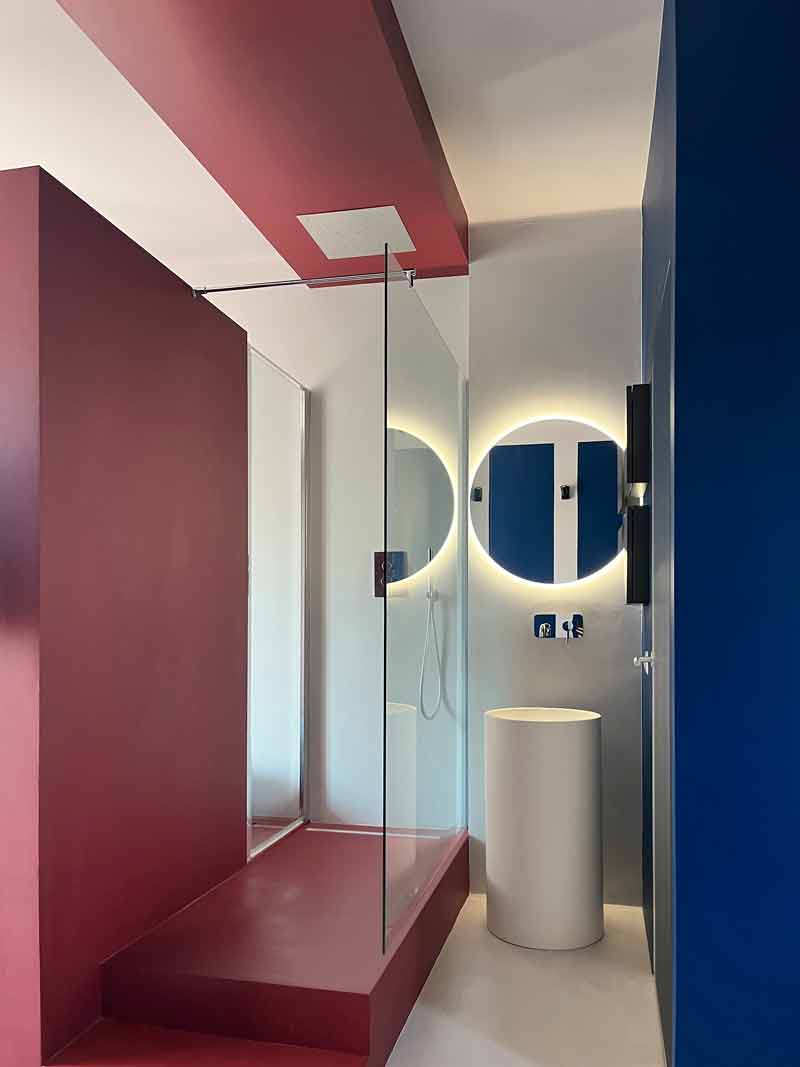 Cooper House, Milanese pied-à-terre is tinged with red and blue.