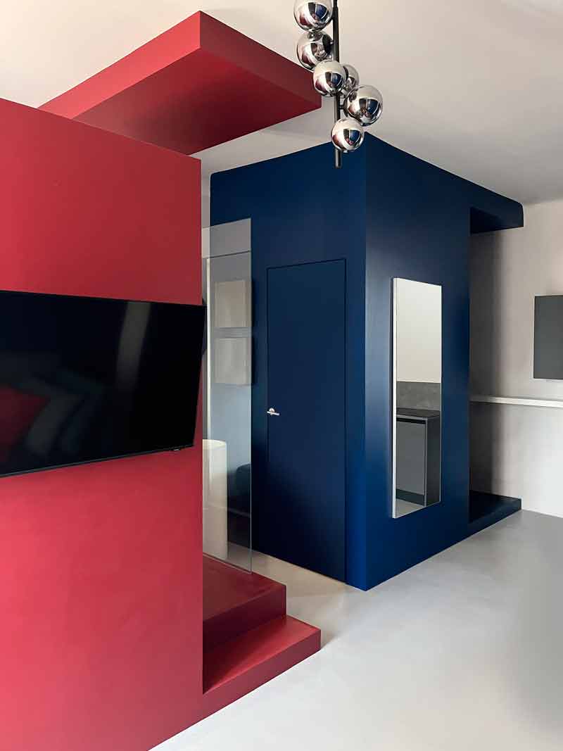 Cooper House, Milanese pied-à-terre is tinged with red and blue.