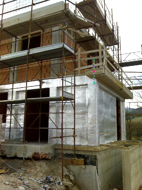 Image of building site of isolated building with Over-All insulation