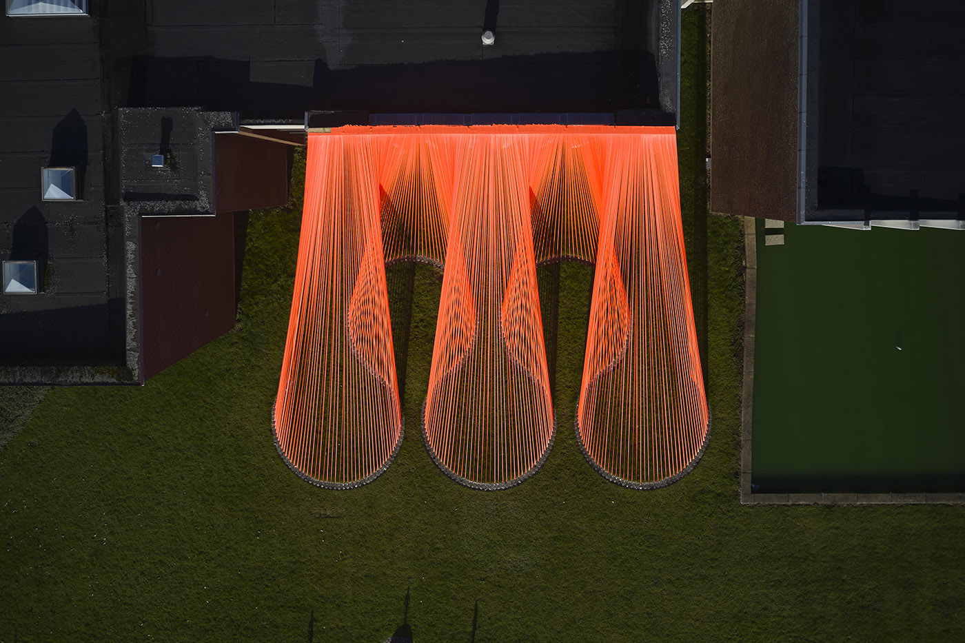 A pavilion of orange threads. United but separate to reflect on the historical moment we are living in
